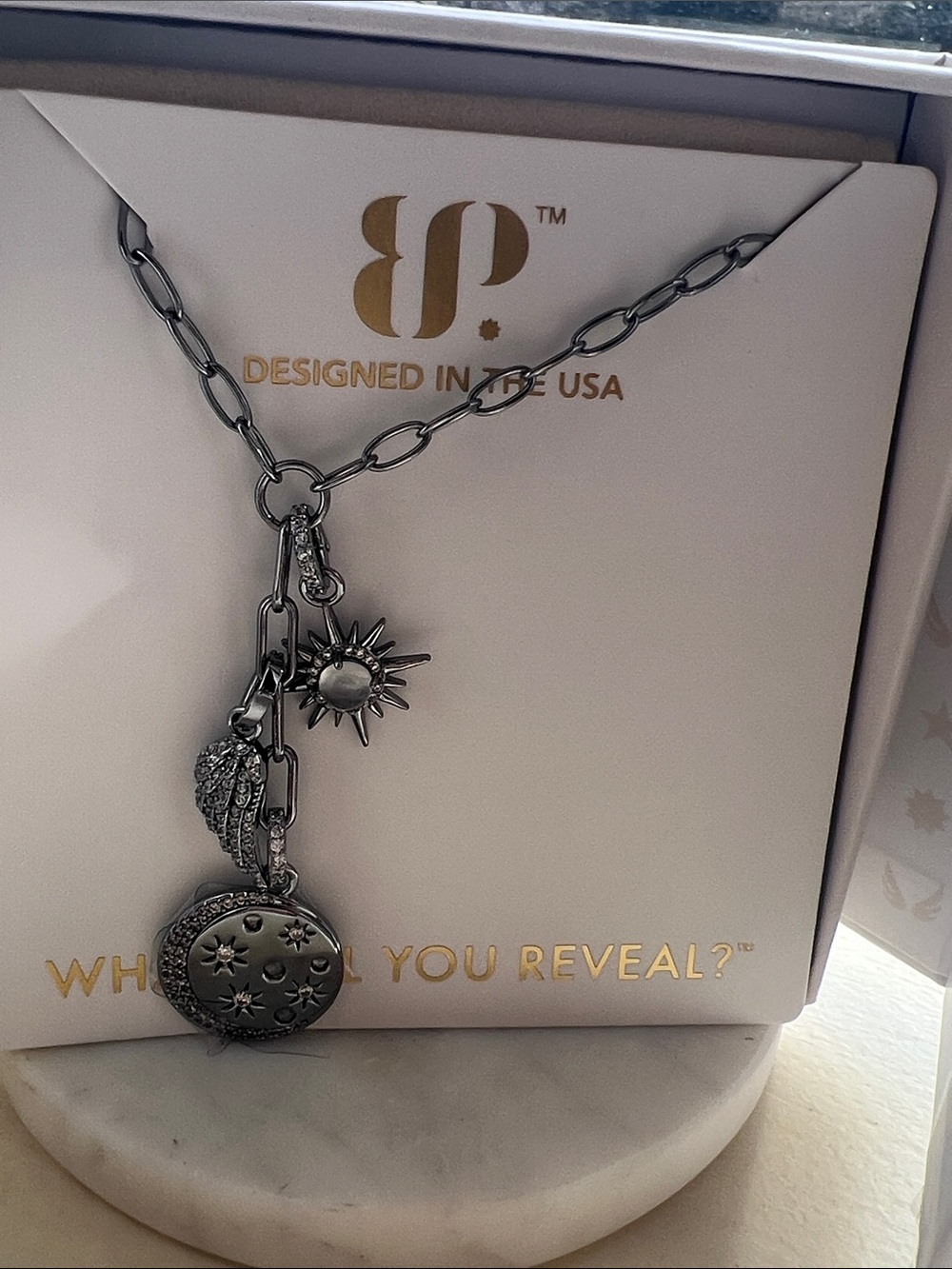 Bp halo a light that lingers hematite Sun & Locket Charm Necklace